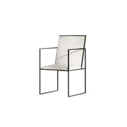 The Joelle dining chair with sleek iron legs, perfect for contemporary dining spaces.